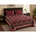 Aaramya Heritage weave collection crimson patchwork bedsheet with intricate traditional patterns and vibrant textile design.